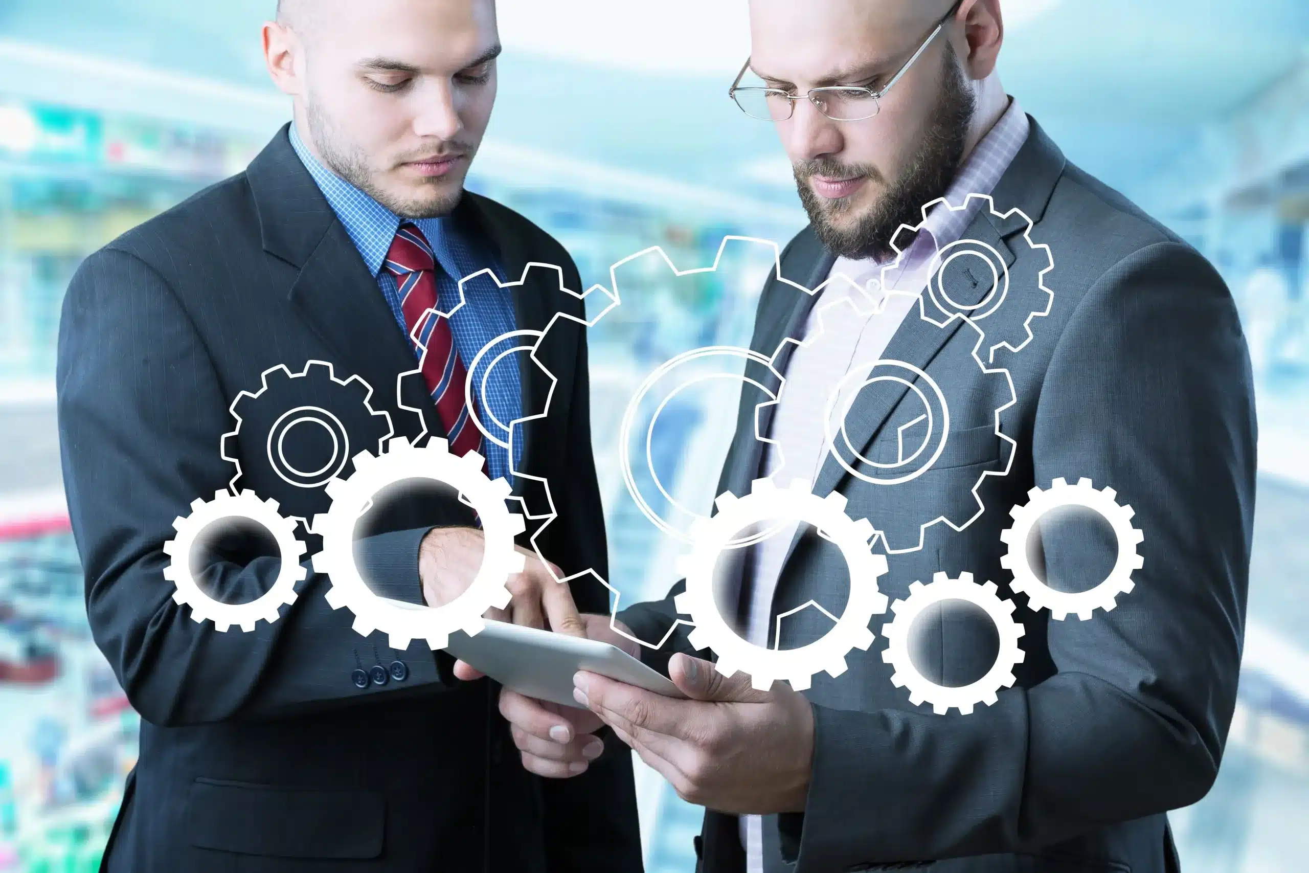 lean-manufacturing-gestores-de-terno-e-gravata-juntos-com-tablet-nas-maos-e-engrenagens-de-inteligencia-artificial